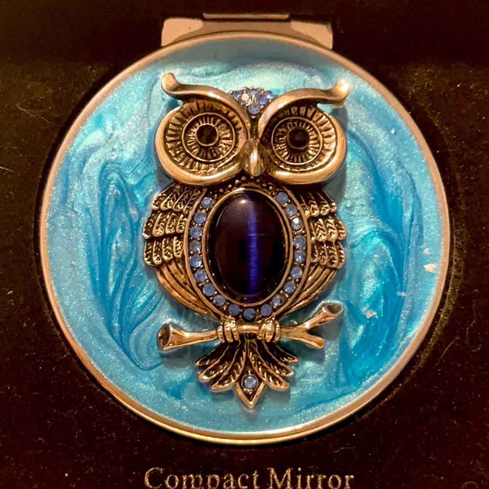 NIB Compact Mirror with both regular and magnifying.